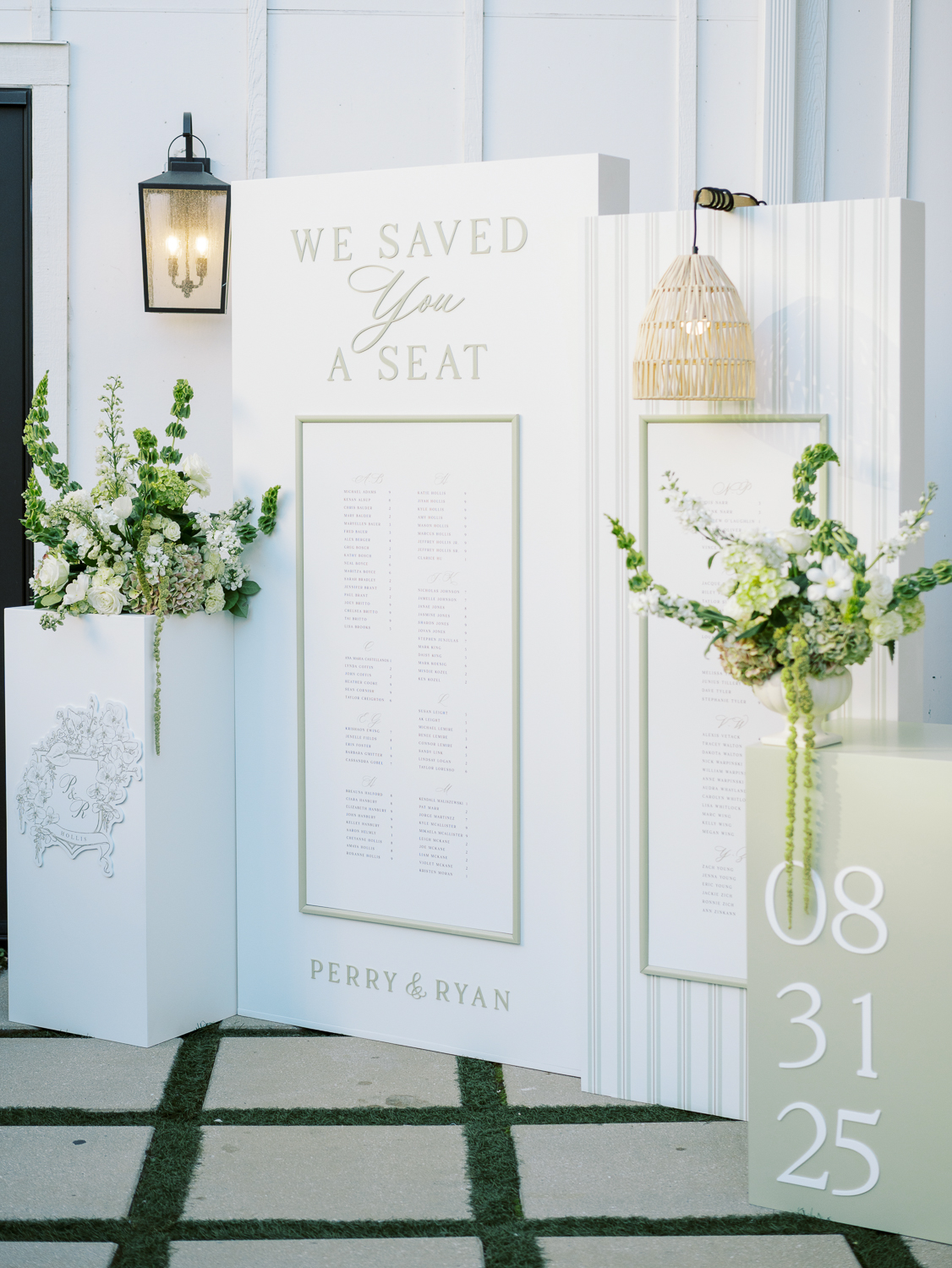 Sage green and white wedding seating chart display at The Bradford in North Carolina